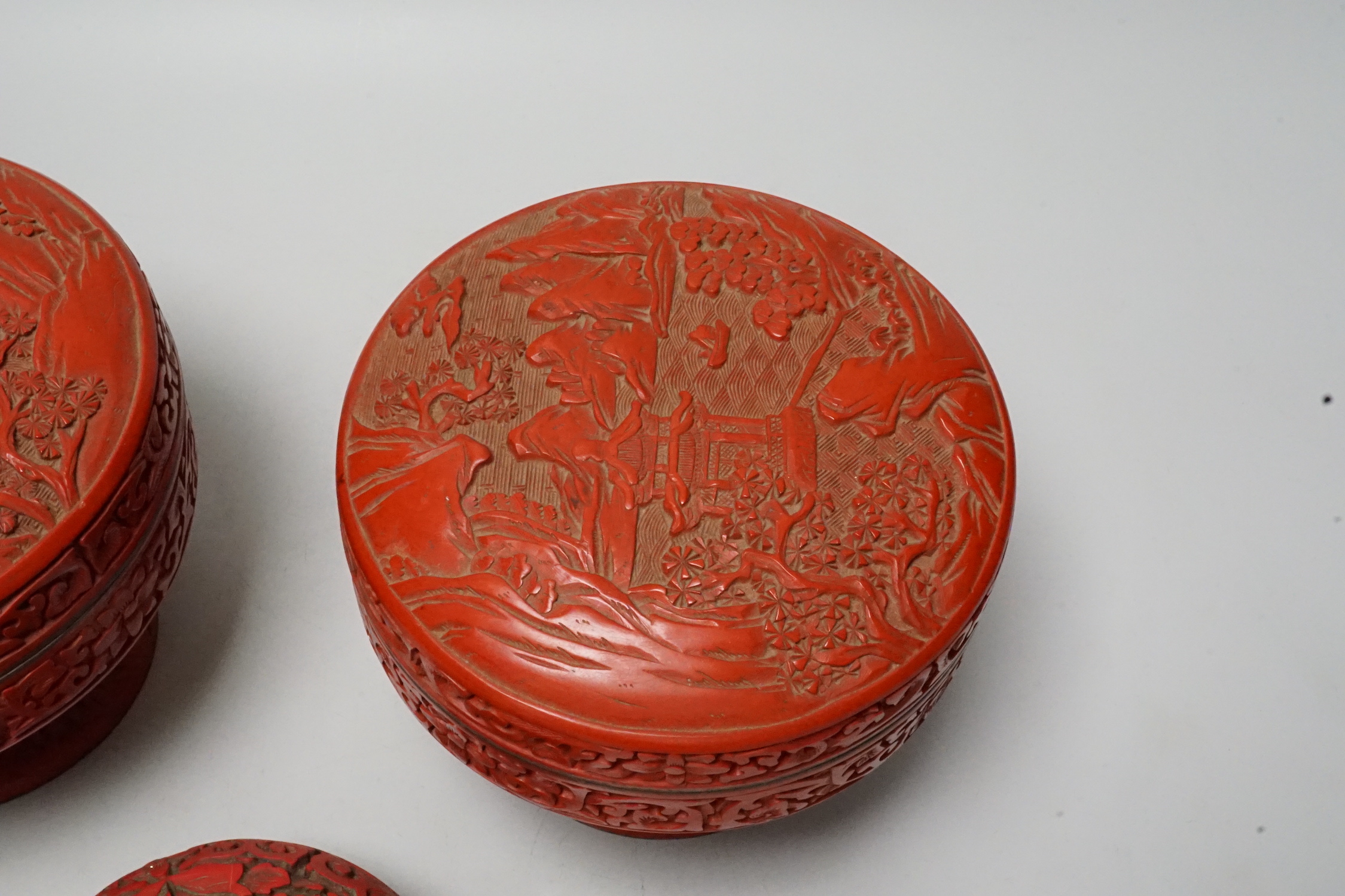Two Chinese red lacquer stem dishes and covers and another box